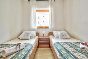Postel nebo postele na pokoji v ubytování Apartments Vera