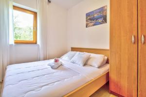 Postel nebo postele na pokoji v ubytování Apartments Vera