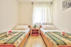 Postel nebo postele na pokoji v ubytování Apartments Vera