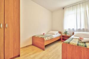 Postel nebo postele na pokoji v ubytování Apartments Vera