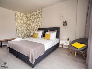 Postel nebo postele na pokoji v ubytování Nayino Resort Hotel