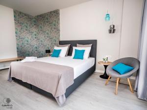 Postel nebo postele na pokoji v ubytování Nayino Resort Hotel