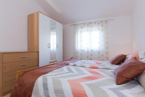 Postel nebo postele na pokoji v ubytování Apartman Ivona