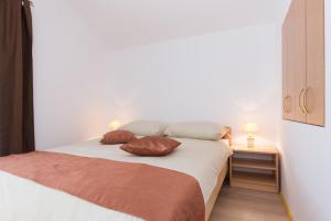 Postel nebo postele na pokoji v ubytování Apartman Ivona