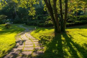 A garden outside Hotel La Bussola
