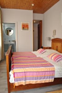 Ein Bett oder Betten in einem Zimmer der Unterkunft Hotel Georges