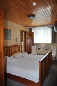 Postel nebo postele na pokoji v ubytování Hotel Georges