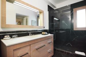 a bathroom with a sink and a mirror at Antica Civita Luxury Room in Matera