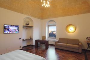 TV a/nebo společenská místnost v ubytování Antica Civita Luxury Room