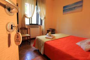 Postel nebo postele na pokoji v ubytování Casa Vacanze Le Querce