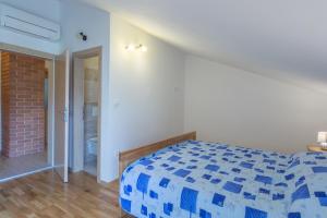 Cama ou camas em um quarto em Stara Kuća Apartments