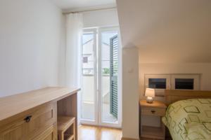 Cama ou camas em um quarto em Stara Kuća Apartments