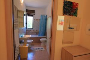 Koupelna v ubytování Casa Vacanze Le Querce + 36 fotografií
