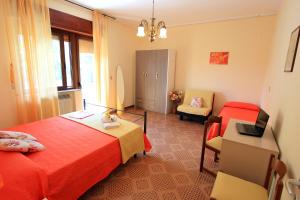 Postel nebo postele na pokoji v ubytování Casa Vacanze Le Querce
