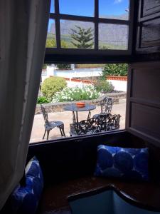 a view of a table and chairs from a window at Casa Gusber I in El Paso