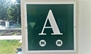 a sign on the side of a building at Albergue Irugoienea in Espinal-Auzperri