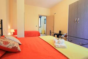 Postel nebo postele na pokoji v ubytování Casa Vacanze Le Querce