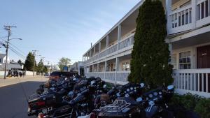 a row of motorcycles parked in front of a building at The Inn at Soho Square in Old Orchard Beach