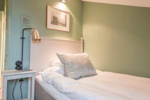 Llit o llits en una habitació de Hotel Kungsträdgården