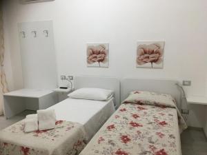Voodi või voodid majutusasutuse B&B ARCHIMEDE toas
