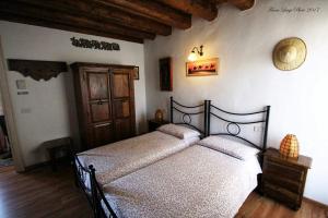 Voodi või voodid majutusasutuse Albergo Julienne toas