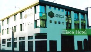 a building with a hiesta hotel on the side of it at Hisca Hotel in Duitama