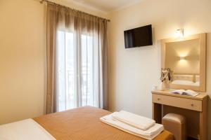 Postel nebo postele na pokoji v ubytování Kavadias Apartments