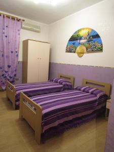 Postel nebo postele na pokoji v ubytování Dolce Dormire