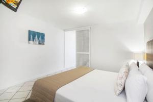 Voodi või voodid majutusasutuse Mantra Mooloolaba Beach toas