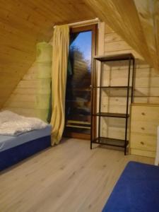 Postel nebo postele na pokoji v ubytování Sjesta -domki letniskowe