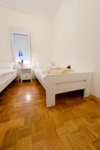 Postel nebo postele na pokoji v ubytování APARTMENT ANA 4+2