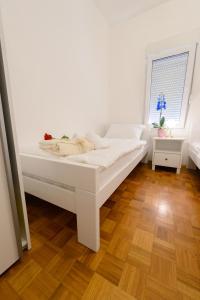 Postel nebo postele na pokoji v ubytování APARTMENT ANA 4+2