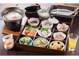 a wooden tray filled with different types of food at Shinyu no Yado SAZANA in Higashiizu