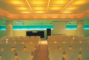 an empty room with chairs and a screen in it at Alexandra Beach Spa Resort in Potos +37 photos
