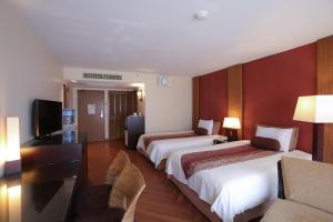Postel nebo postele na pokoji v ubytování Guam Reef Hotel
