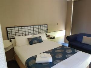 Postel nebo postele na pokoji v ubytování Motel Traralgon