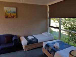 Postel nebo postele na pokoji v ubytování Motel Traralgon