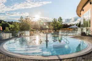 Bazén v ubytovaní Thermenhotel PuchasPLUS Stegersbach alebo v jeho blízkosti
