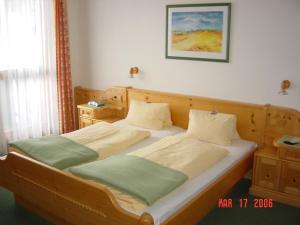 Postel nebo postele na pokoji v ubytování Hotel Sporthof Austria