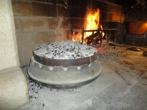 a large cake in front of a fireplace at Farm stay File in Slope