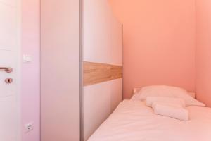 Postel nebo postele na pokoji v ubytování Apartmani Lukić