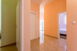 Postel nebo postele na pokoji v ubytování Apartmani Lukić