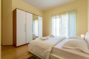 Postel nebo postele na pokoji v ubytování Apartmani Lukić