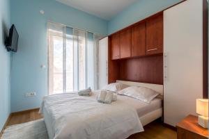 Postel nebo postele na pokoji v ubytování Apartmani Lukić