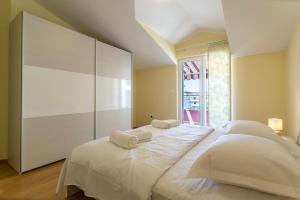 Postel nebo postele na pokoji v ubytování Apartmani Lukić