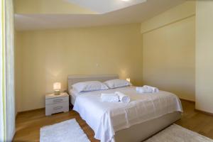 Postel nebo postele na pokoji v ubytování Apartmani Lukić