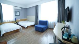 Postel nebo postele na pokoji v ubytování Beijing Sicily Hotel + 25 fotografií