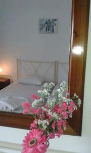 Ліжко або ліжка в номері Artemis Rooms