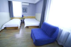 Postel nebo postele na pokoji v ubytování Beijing Sicily Hotel