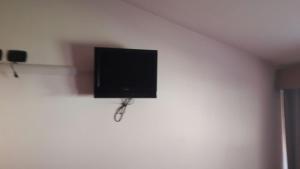 a flat screen tv hanging on a wall at Affittacamere L'Airone in Villetta Barrea